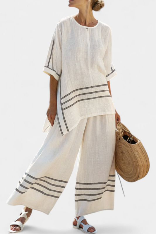 Eden – Sophisticated Striped Asymmetric Top and Bold Trousers